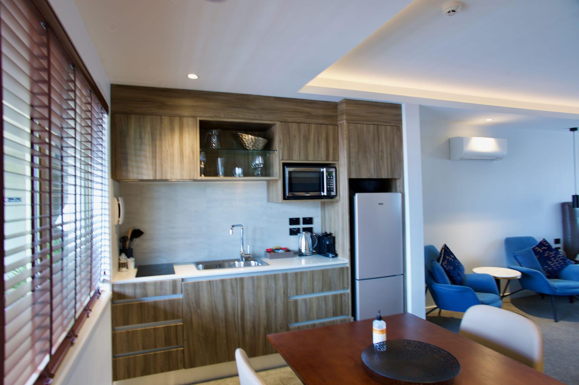 Regal Palms Resort Rotorua Exterior photo A kitchen in a hotel suite